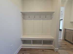 Mudroom with dark wood-style flooring