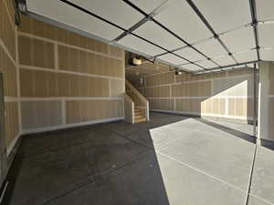 Garage featuring a garage door opener