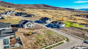 Aerial view of residential area featuring a mountain backdrop