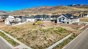 Rear view of house with a mountain view and a residential view
