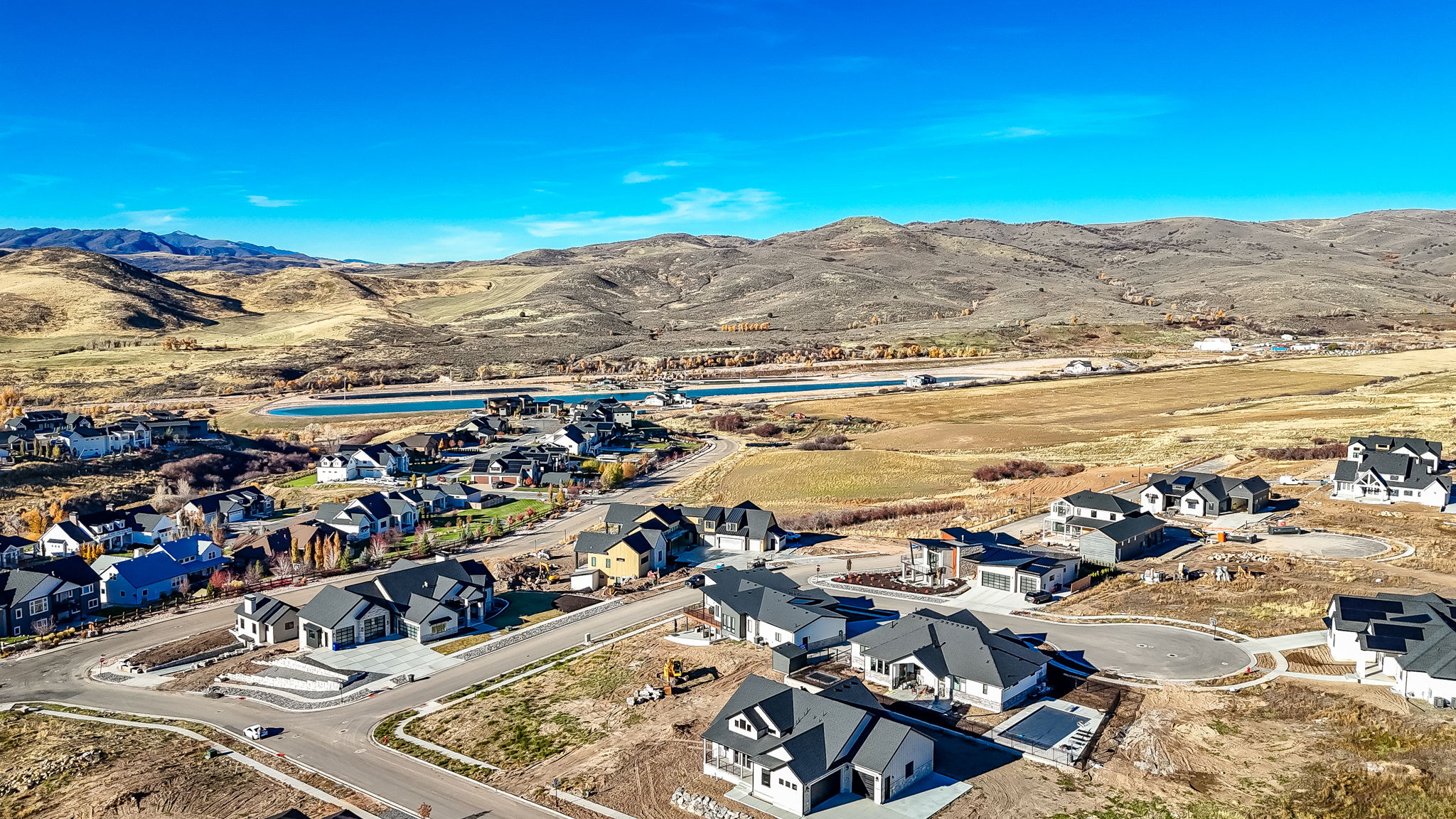 Aerial view of residential area featuring a water and mountain view