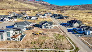 Aerial view of residential area featuring a mountainous background