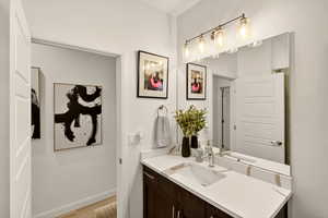 Bathroom with vanity and light wood-type flooring
