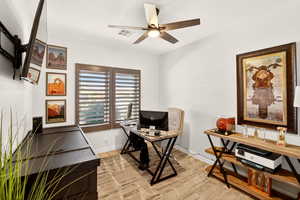Office featuring light wood finished floors and ceiling fan
