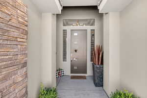 Property entrance with stucco siding