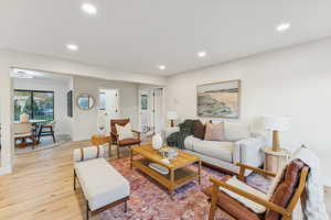Living area featuring recessed lighting and light wood-style floors