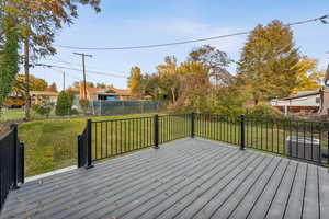 Wooden deck featuring a fenced backyard