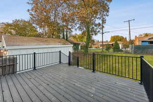 Deck featuring a lawn