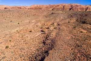 View of mountain backdrop with a desert landscape and rural landscape