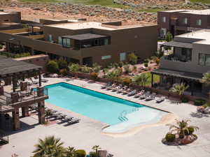 Community pool featuring a patio and a pergola