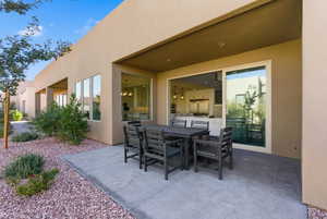 View of patio with outdoor dining area
