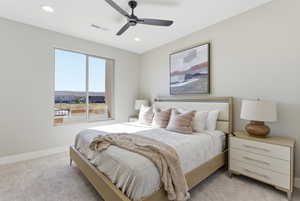 Bedroom with light carpet, ceiling fan, and recessed lighting