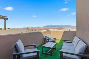 View of patio featuring a mountain view and an outdoor hangout area