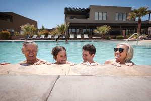 Community pool with a patio