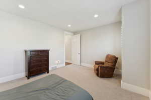 Carpeted bedroom featuring recessed lighting and baseboards