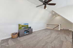 Unfurnished living room featuring lofted ceiling, light colored carpet, recessed lighting, and a ceiling fan
