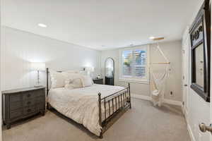 Bedroom featuring light carpet and recessed lighting