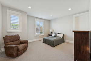 Bedroom with recessed lighting and carpet