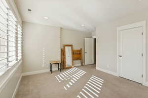 Unfurnished bedroom with recessed lighting and light colored carpet