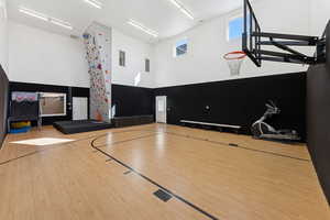 View of sport court featuring basketball hoop
