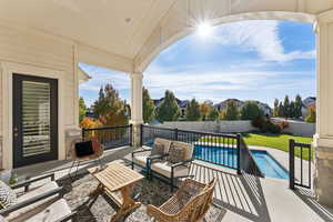 Fenced backyard featuring a patio and an outdoor hangout area