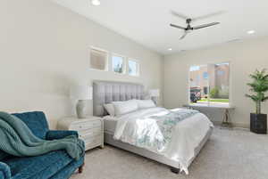 Carpeted bedroom featuring ceiling fan and recessed lighting