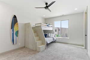 Bedroom with carpet, a ceiling fan, and recessed lighting