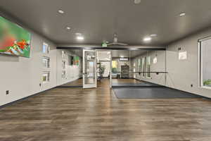 Workout room with french doors, recessed lighting, and a ceiling fan
