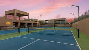 View of tennis court with community basketball court