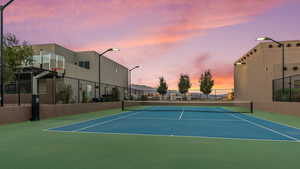 View of tennis court with community basketball court