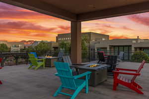 View of patio with a fire pit