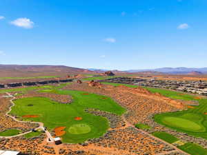 Bird's eye view of a mountain backdrop and a golf course