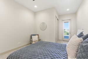Carpeted bedroom with recessed lighting, access to exterior, and a ceiling fan