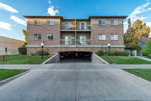 View of property with concrete driveway