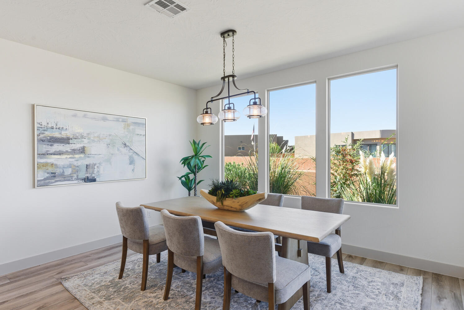 Dining room featuring light wood-style flooring and a chandelier
