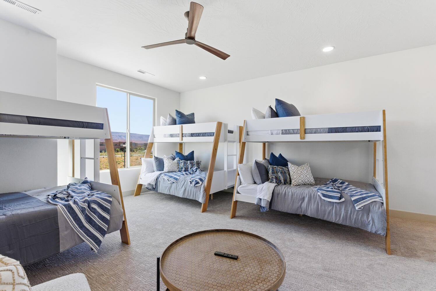 Bedroom with carpet floors, a ceiling fan, a mountain view, and recessed lighting