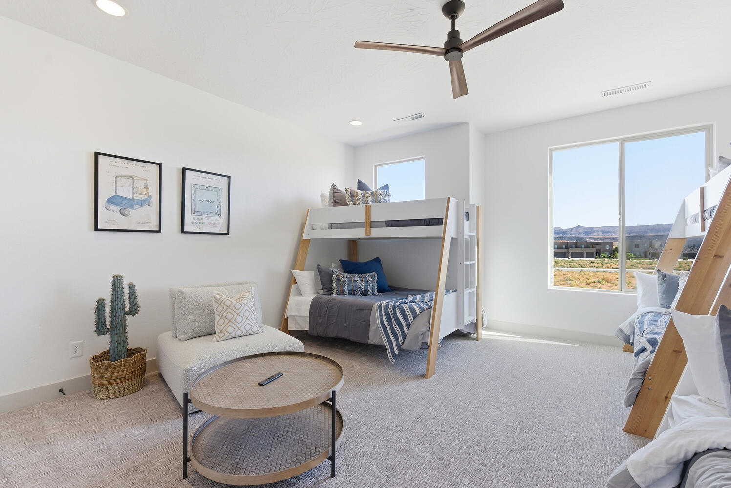 Carpeted bedroom featuring ceiling fan and recessed lighting