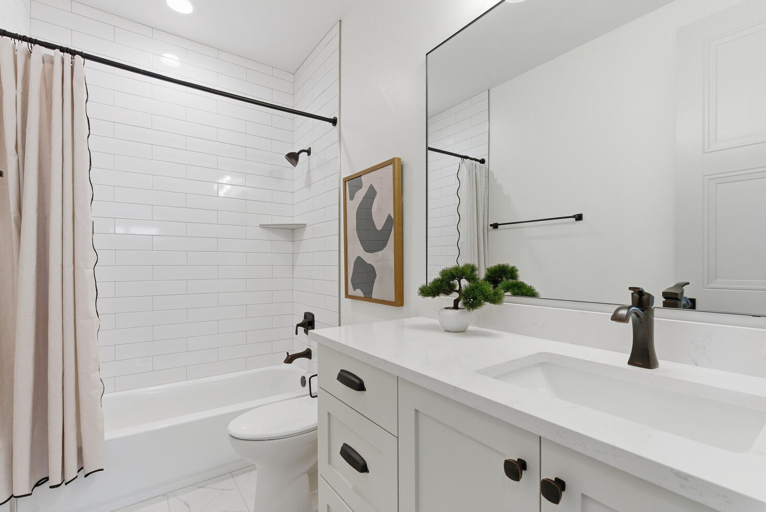 Full bath featuring vanity and shower / tub combo