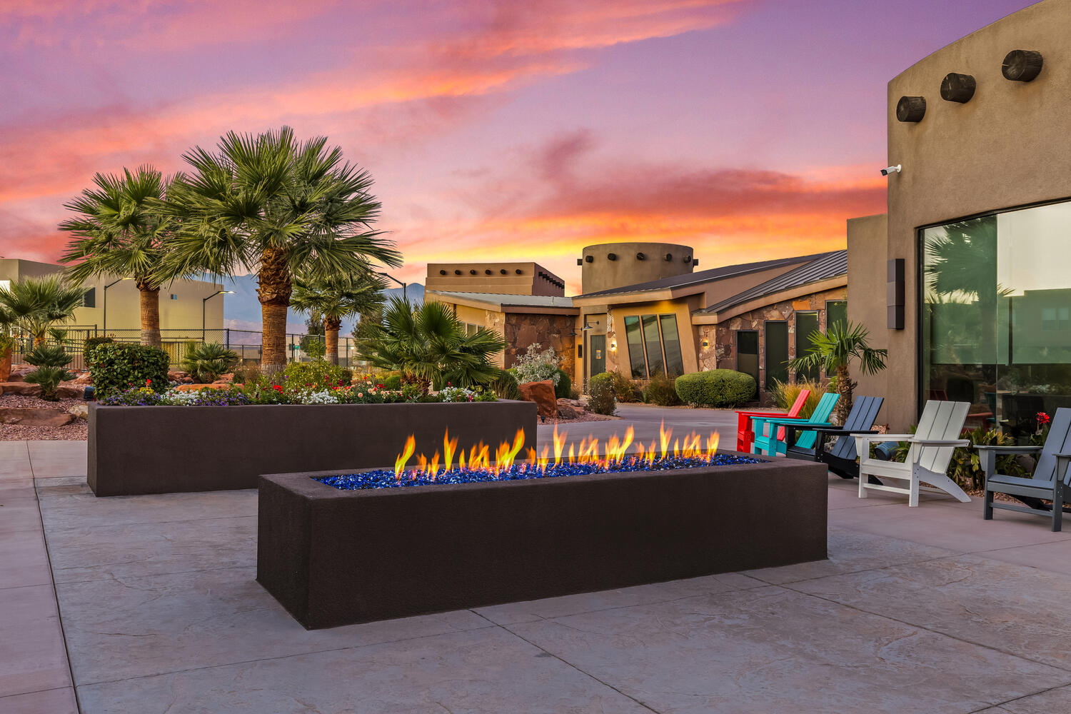 Patio terrace at dusk with a fire pit and a patio area