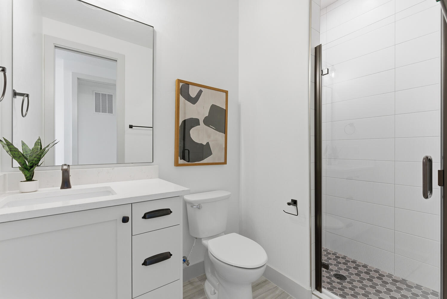 Bathroom featuring vanity and a stall shower