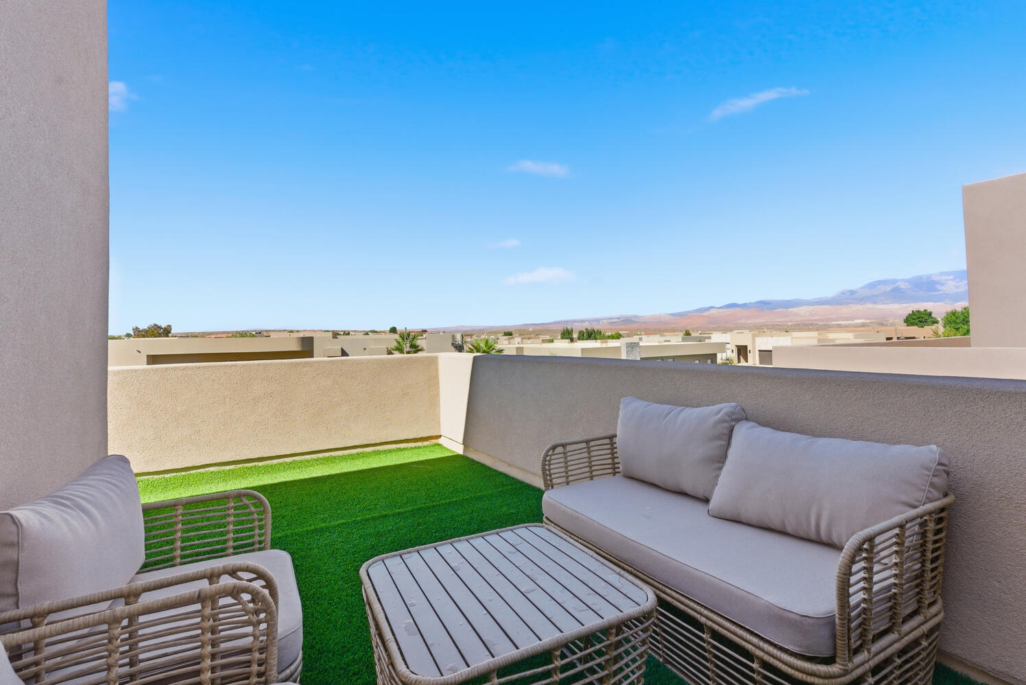 View of patio featuring an outdoor living space and a mountain view