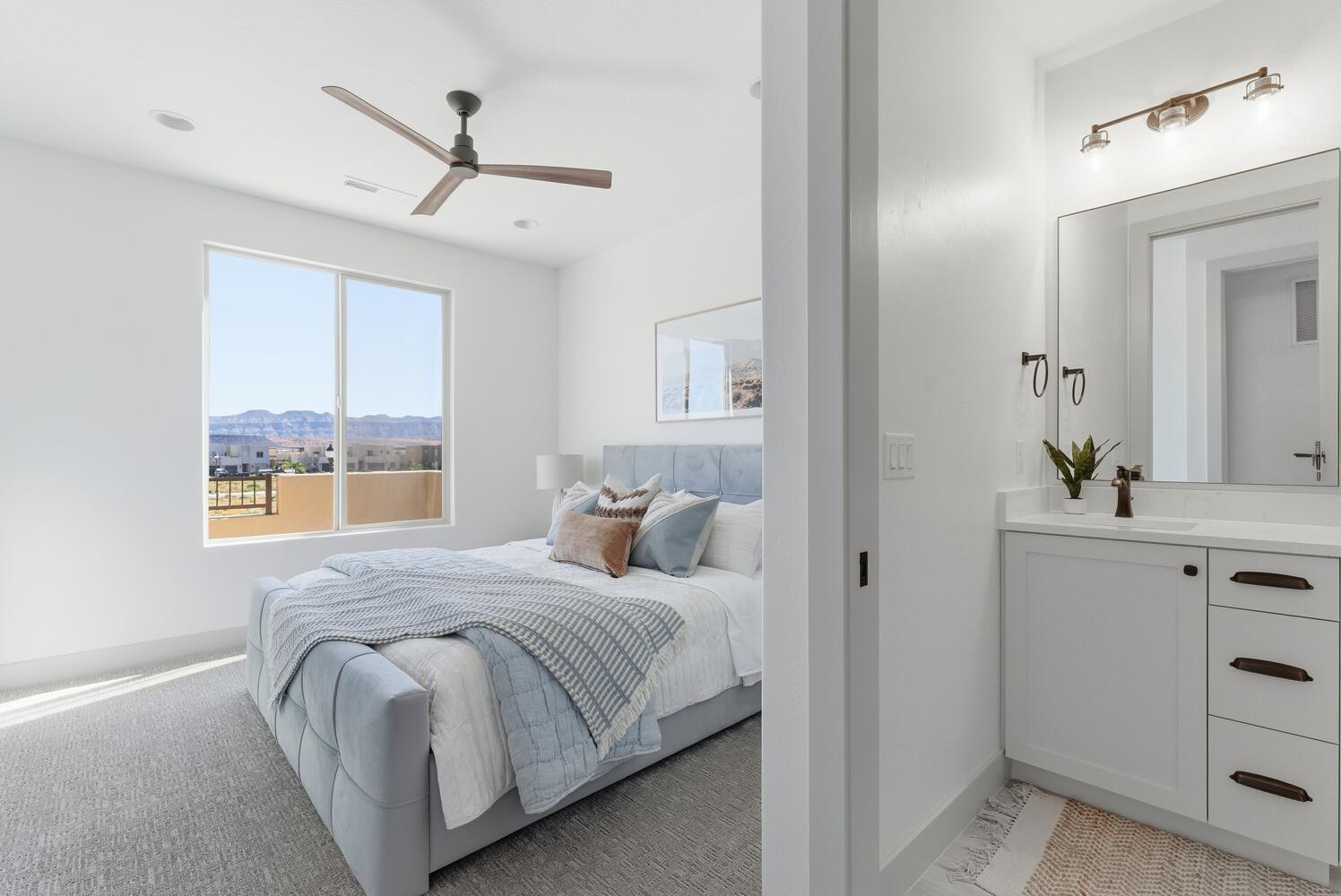 Bedroom featuring baseboards and ceiling fan