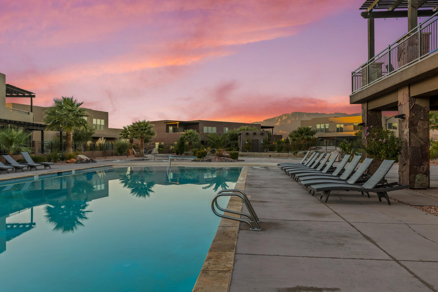 Community pool with a patio area, a pergola, and a mountain view