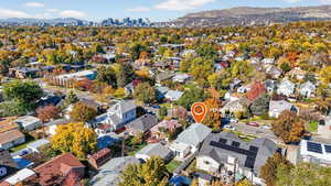 Bird's eye view of city skyline and mountains