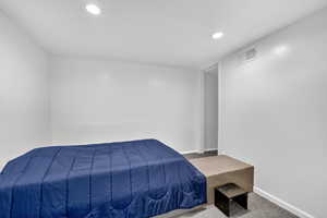 Bedroom featuring carpet floors and recessed lighting
