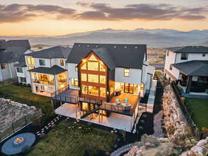 Back of property featuring a patio, a fenced backyard, and a mountain view