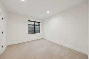 Basement apartment bedroom, #7/8, with light carpet