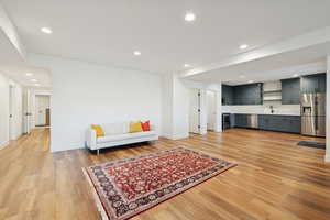 Basement apartment dining area featuring recessed lighting and light wood-style flooring