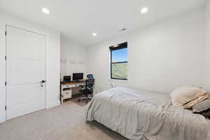 Upstairs bedroom, #5/8, featuring an office area and recessed lighting