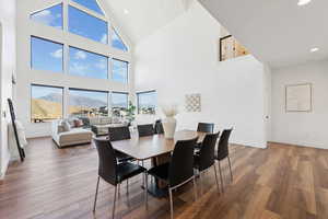 Dining area with a mountain view and high vaulted ceiling